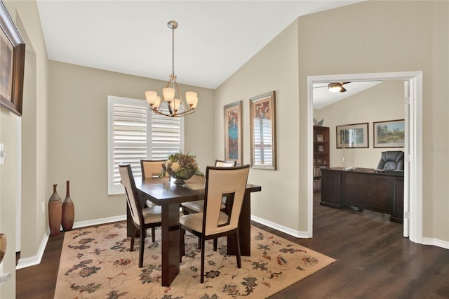 dining room featuring vaulted ceiling, a notable chandelier, dark hardwood / wood-style flooring, and a wealth of natural light
