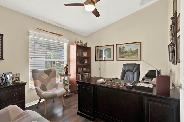 home office with ceiling fan, vaulted ceiling, and dark hardwood / wood-style floors