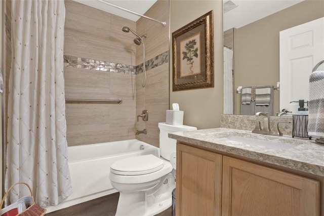 full bathroom with vanity, toilet, shower / bathtub combination with curtain, and hardwood / wood-style floors