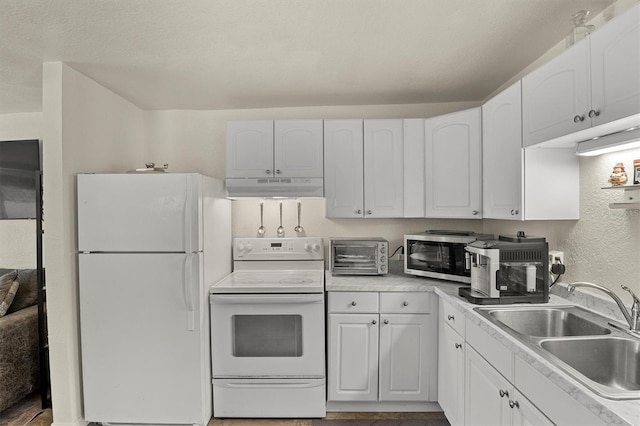 kitchen featuring sink, white cabinets, and white appliances