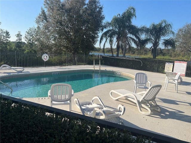 view of swimming pool featuring a patio area