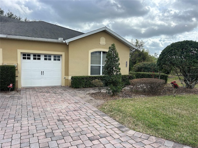 view of side of home featuring a garage