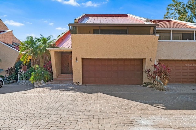 view of front of property featuring a garage