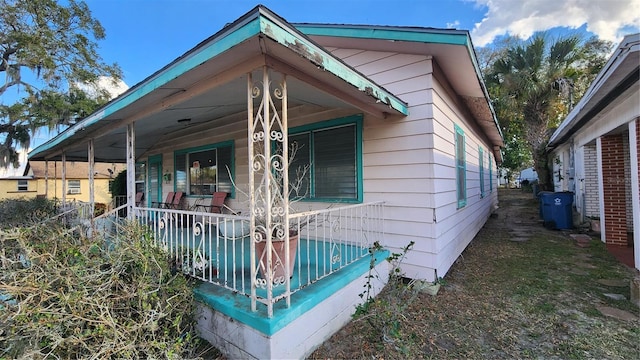 view of home's exterior featuring covered porch