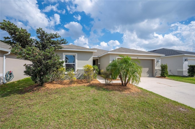 single story home featuring a garage and a front yard