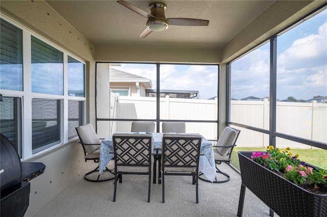 sunroom / solarium with ceiling fan