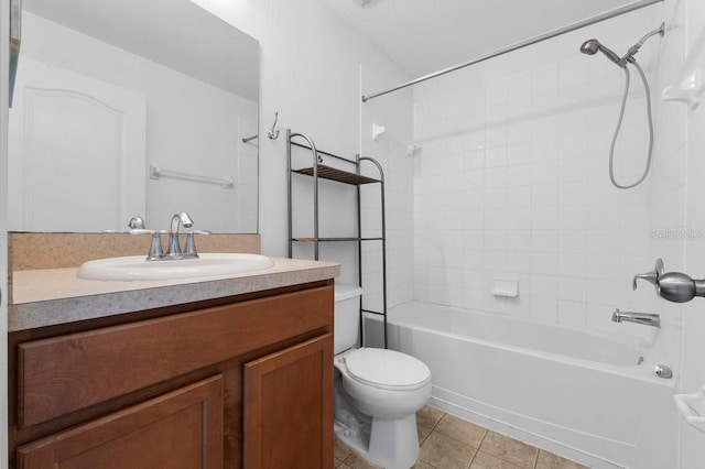 full bathroom featuring tiled shower / bath combo, vanity, tile patterned floors, and toilet