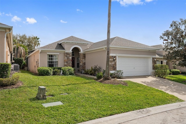 view of front of property with a garage, a front yard, and cooling unit