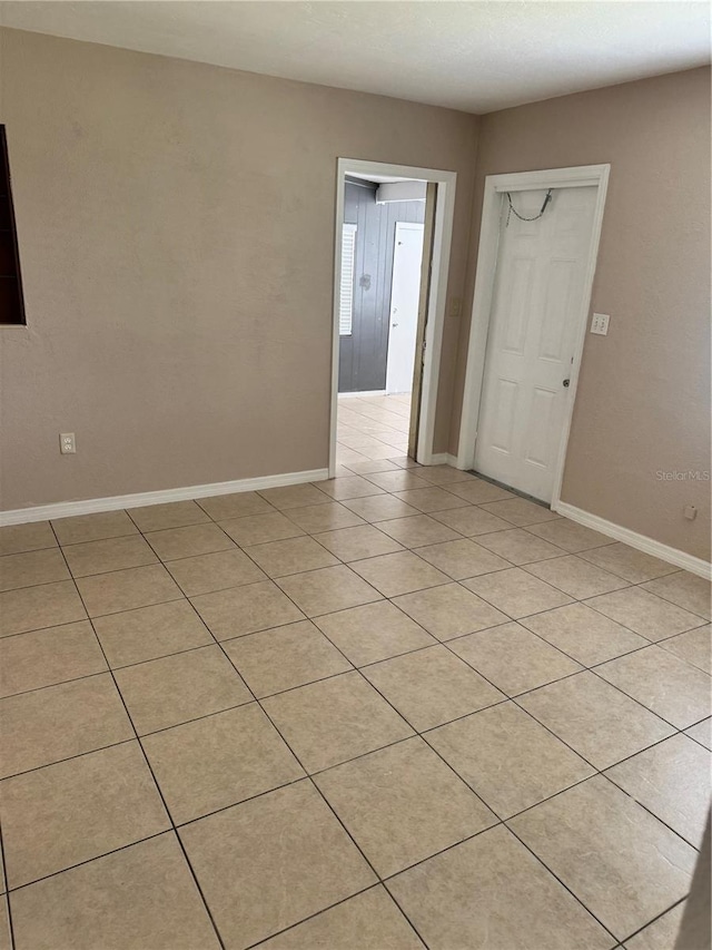 empty room with light tile patterned flooring