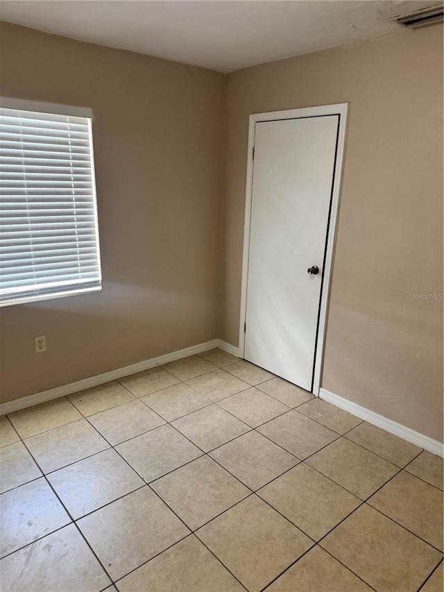 view of tiled spare room