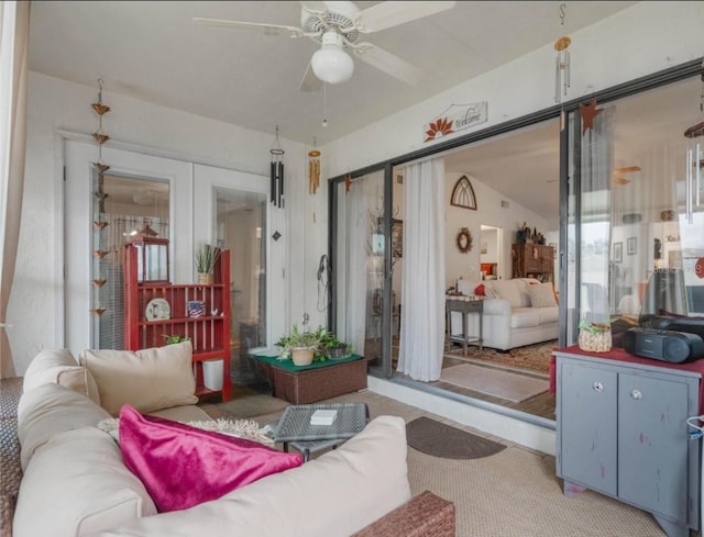 living room featuring french doors and ceiling fan