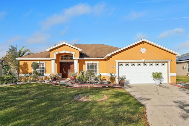 single story home with a front yard and a garage