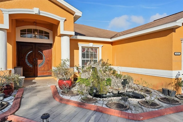 property entrance featuring french doors