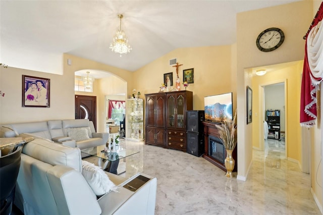 living room with vaulted ceiling and a chandelier