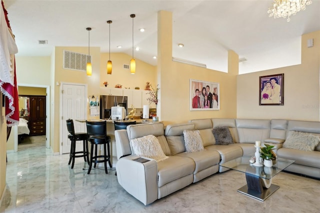 living room with high vaulted ceiling