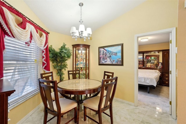 dining space featuring a notable chandelier and vaulted ceiling