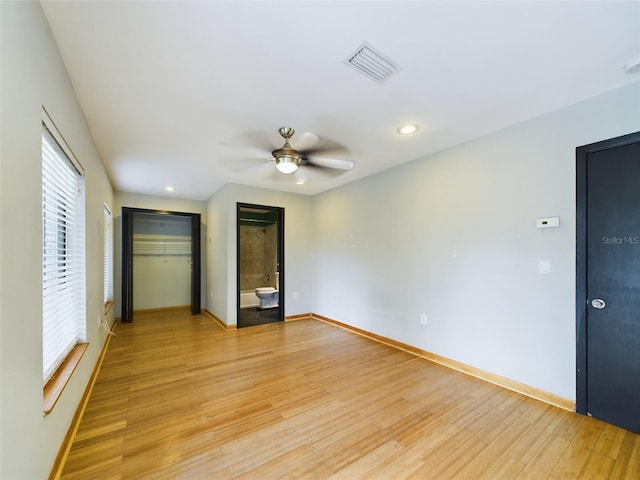 1793 N Fort Harrison Ave, Clearwater, FL 33755 - unfurnished bedroom with ceiling fan, ensuite bath, and light hardwood / wood-style floors