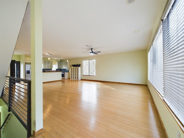 1793 N Fort Harrison Ave, Clearwater, FL 33755 - unfurnished living room featuring ceiling fan and light wood-type flooring