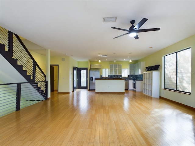 1793 N Fort Harrison Ave, Clearwater, FL 33755 - unfurnished living room with ceiling fan and light wood-type flooring