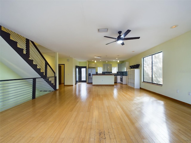 1793 N Fort Harrison Ave, Clearwater, FL 33755 - unfurnished living room featuring ceiling fan and light hardwood / wood-style flooring