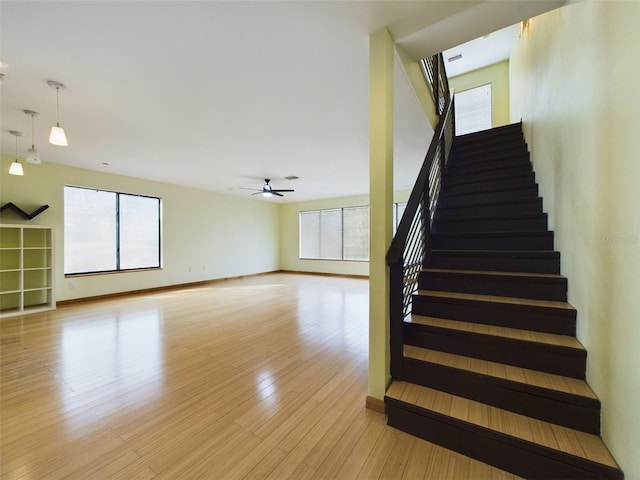 1793 N Fort Harrison Ave, Clearwater, FL 33755 - staircase with a healthy amount of sunlight, hardwood / wood-style floors, and ceiling fan