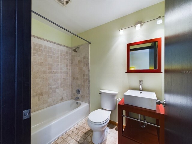 1793 N Fort Harrison Ave, Clearwater, FL 33755 - full bathroom featuring vanity, tiled shower / bath combo, and toilet