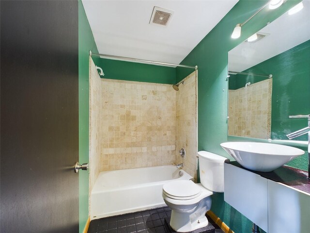 1793 N Fort Harrison Ave, Clearwater, FL 33755 - full bathroom featuring vanity, tile patterned floors, toilet, and tiled shower / bath