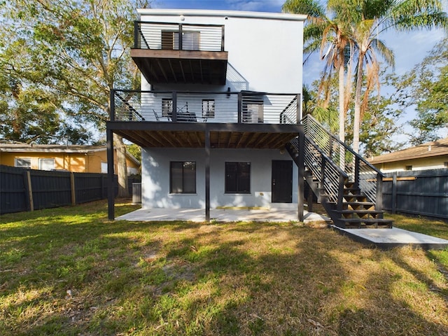 1793 N Fort Harrison Ave, Clearwater, FL 33755 - rear view of house with a yard, a deck, and a patio