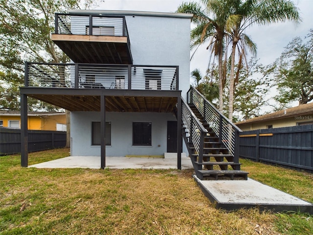 1793 N Fort Harrison Ave, Clearwater, FL 33755 - back of property featuring a lawn, a patio, and a deck