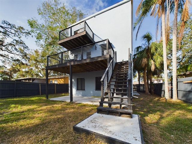 1793 N Fort Harrison Ave, Clearwater, FL 33755 - rear view of house with a patio and a yard