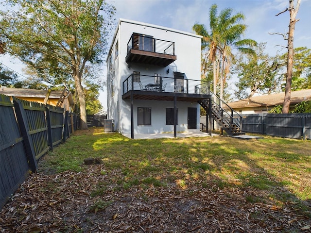 1793 N Fort Harrison Ave, Clearwater, FL 33755 - rear view of property with a patio, a balcony, a yard, and cooling unit