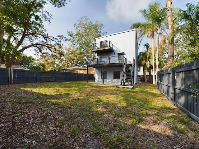 1793 N Fort Harrison Ave, Clearwater, FL 33755 - back of house featuring a wooden deck and a lawn