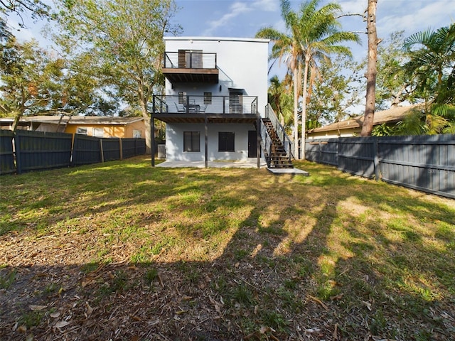 1793 N Fort Harrison Ave, Clearwater, FL 33755 - rear view of house featuring a lawn, a deck, a balcony, and a patio area
