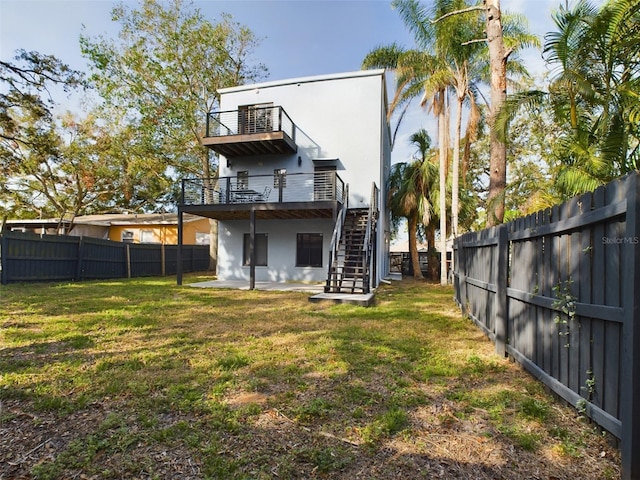1793 N Fort Harrison Ave, Clearwater, FL 33755 - back of property with a balcony and a lawn
