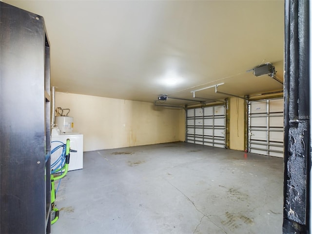 1793 N Fort Harrison Ave, Clearwater, FL 33755 - garage featuring a garage door opener, water heater, and washing machine and clothes dryer