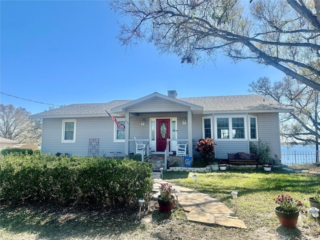 single story home featuring a front yard