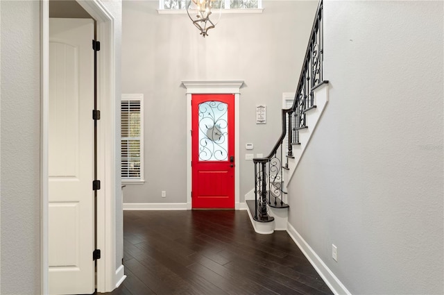 foyer entrance featuring dark wood-type flooring