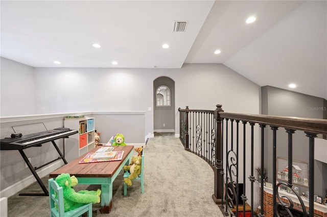 recreation room featuring light carpet and lofted ceiling