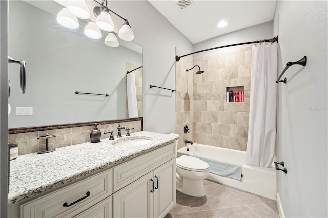 full bathroom with tile patterned flooring, shower / bathtub combination with curtain, vanity, and toilet