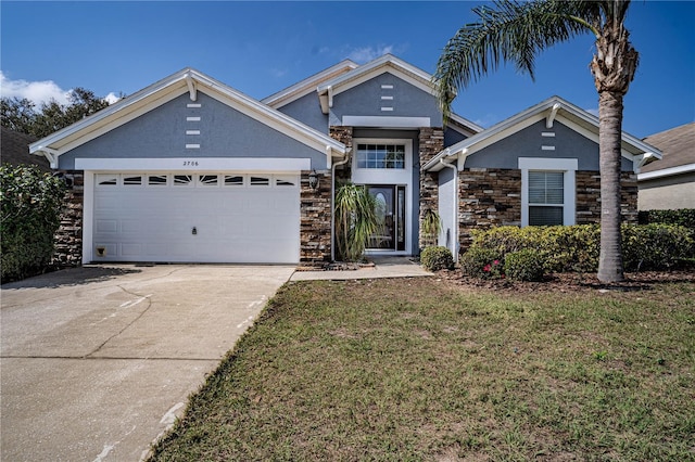 view of front of house featuring a front yard and a garage