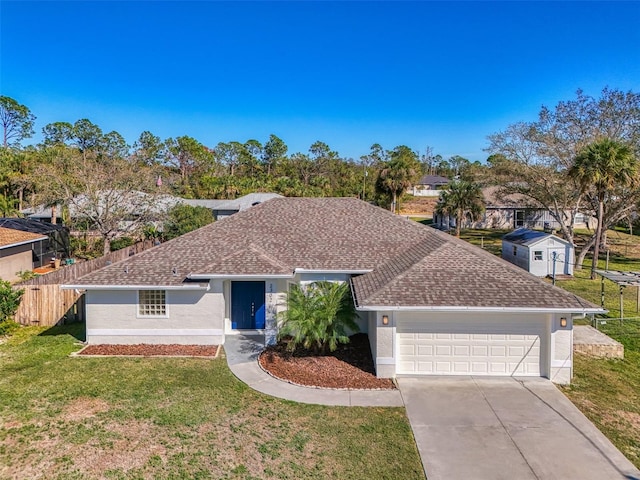 ranch-style home featuring a garage and a front lawn