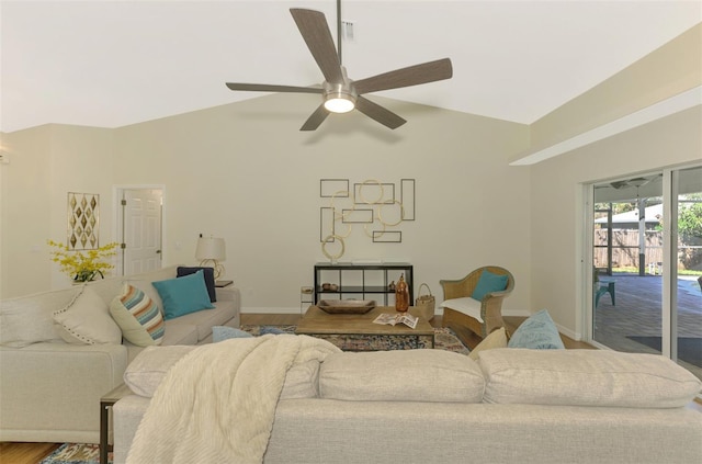 living room featuring hardwood / wood-style floors, lofted ceiling, and ceiling fan