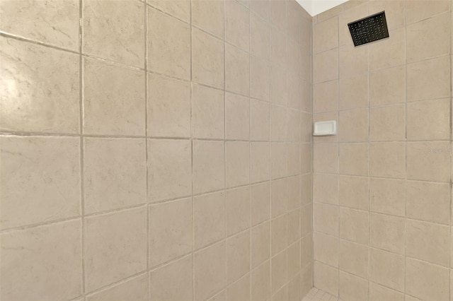 bathroom with tiled shower