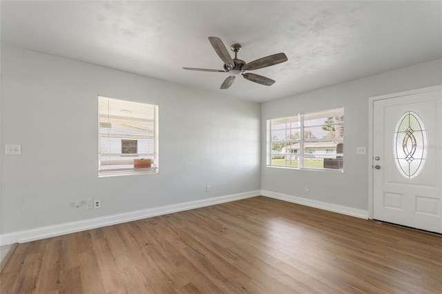 foyer with hardwood / wood-style floors and ceiling fan