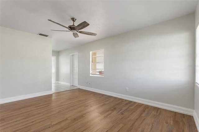 unfurnished room with light hardwood / wood-style flooring and ceiling fan