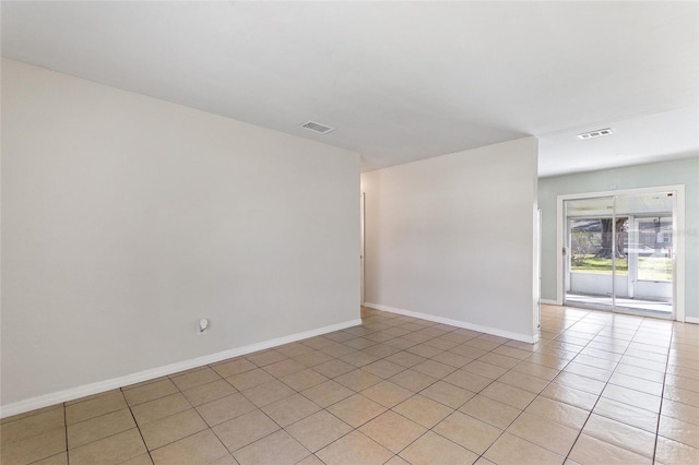 view of tiled spare room