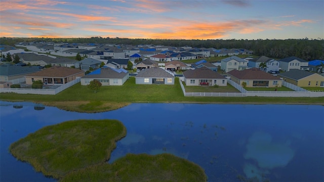 aerial view with a residential view and a water view