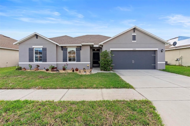 ranch-style home with driveway, a shingled roof, an attached garage, a front lawn, and stucco siding
