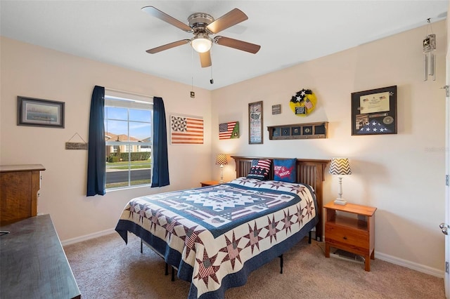 bedroom with carpet flooring, ceiling fan, and baseboards