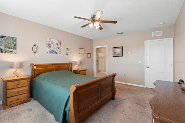 bedroom with ceiling fan, baseboards, visible vents, and light colored carpet